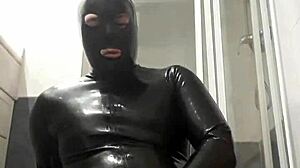 latex guy wanks in suggestive gay scene.