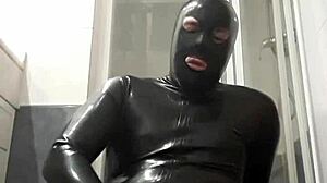 latex guy wanks in suggestive gay scene.