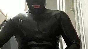 latex guy wanks in suggestive gay scene.