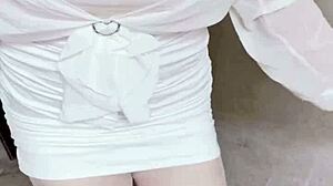 office worker in female outfit masturbates in corridor