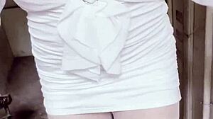 office worker in female outfit masturbates in corridor