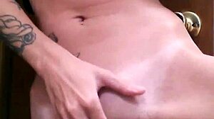 Tattoo Slut Fingers Herself Hard in Bathroom Solo Scene