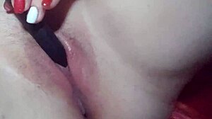 Young Woman Masturbates Close-Up with Vibrator to Orgasm