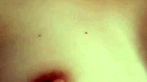 Girl masturbates showing tits and pussy