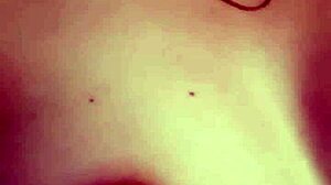 Girl masturbates showing tits and pussy