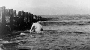 Back in 1943, a girl and woman got naked for slow-motion beach action.