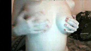 russian girl enjoys her boobs groping on webcam.