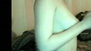 russian girl enjoys her boobs groping on webcam.
