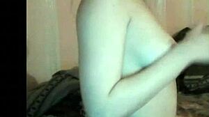 russian girl enjoys her boobs groping on webcam.