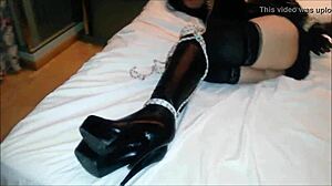 A bound pato22cd experiences intense bondage play.