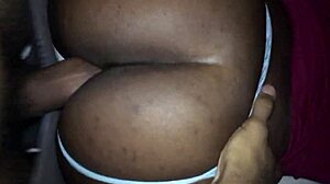 Ebony couple bent over in doggystyle position.