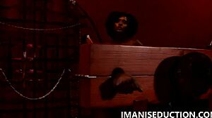 sexy mean domme spanks her sub in the pillory