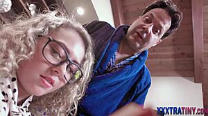 small teen with glasses eagerly gobbles cock in hardcore cumshot session.