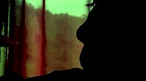 young couple in shadows giving blowjob to each other