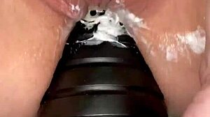 anal play with tower dildo in close-up view