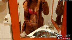 Blonde woman in public bathroom looking for company