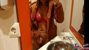 Blonde woman in public bathroom looking for company