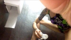 Naked woman pees on car seat in pantyhose close-up