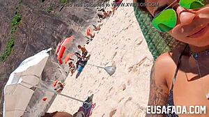 Latina exposes pussy on beach