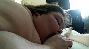 In the hotel, the SSBBW performs a blowjob on her partner.