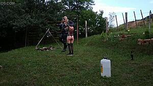 Sexy Goth Domina Beth Trains Shemale Slave Outdoors in Latex