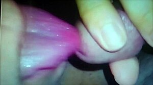 A sexy woman indulges in self-pleasure with fingering and blowjob fantasies