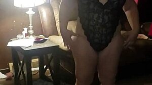 Woman Rips Off Black Dress in Striptease