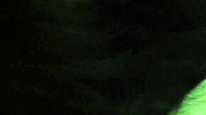 A transgender person in crossdressing attire engages in deep throat activity.