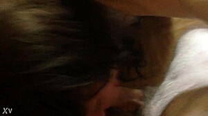 A transgender person in crossdressing attire engages in deep throat activity.