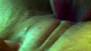 Girl teases her clit with dildo in fun pussy play session.