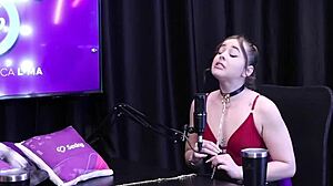 Evelyn Zain in sheer red lingerie receives golden shower in BDSM session