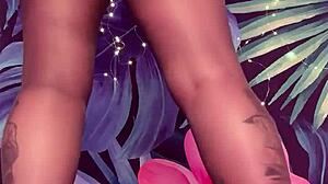 Teasing in pantyhose and latex dress with big tits and feet