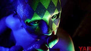 The masked woman bites the penis head and foreskin during a blowjob, swallowing cum