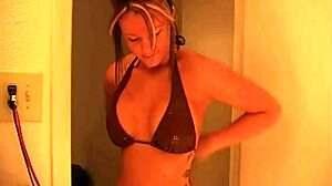 Kayden Krush applies makeup with her big boobs on display