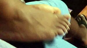 Wife gives intriguing footjob to husband in bedroom scene