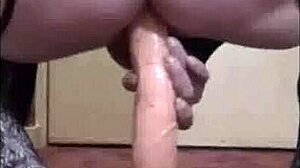 Huge dildo insertion nearly balls deep in bisexual scene