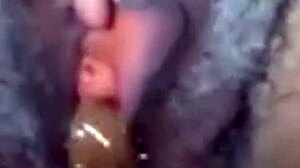 Damn, watch this amateur ebony squirt while sucking huge cock!