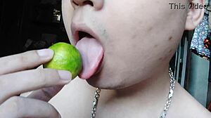 The Asian girl engages in detailed licking and masturbation of her body.