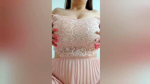 young cutie in pink dress fingers herself on camera