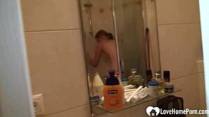 Blonde beauty pleasures herself in the shower
