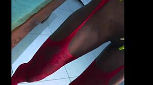 Tropicalpussy teases in red high heels with alluring ebony features.