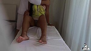 The camera captures a married latina in a short dress giving a handjob to her tantric masseur