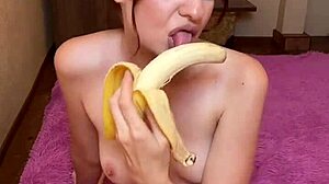 hot brunette sucks banana seductively