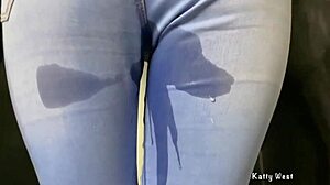 Golden shower drenches girl in soaked pissed jeans