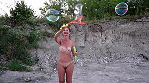 soap bubbles popping in outdoor naked amateur scene