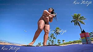 some tanned big ass girl with long hair shows off tan lines at beach