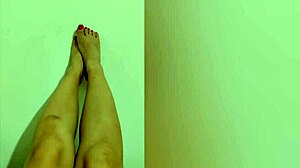 Shy petite hottie feels horny showing off her sexy legs and red pedicure on camera