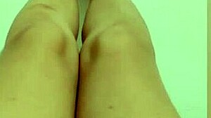 Shy petite hottie feels horny showing off her sexy legs and red pedicure on camera