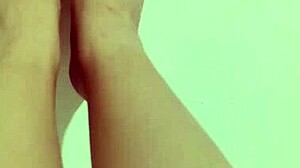 Shy petite hottie feels horny showing off her sexy legs and red pedicure on camera