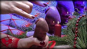 Mrs. Santa Claus teases hubby's peehole with a sly handjob